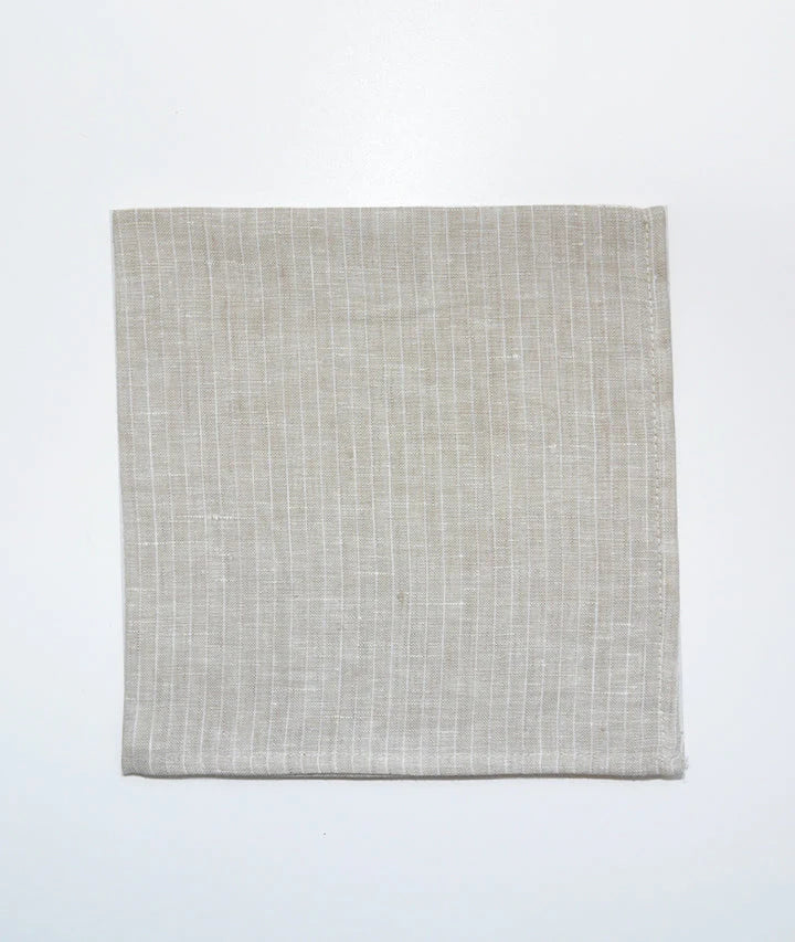 Beautifully crafted in Oeko-Tex linen, these soft beige napkins have subtle thin stripes that will grace any table. Perfect for fancy or fuss free tables, these napkins are sustainable, absorbent, lint free and gorgeous!   100% linen Size is 18x18" Designed in Canada and made in Europe  Machine washable