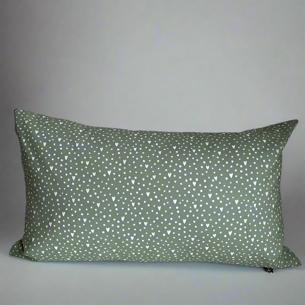 Show you care with this beautiful flowers and hearts organic cotton lumbar pillow.  Made with love in Canada, this whimsical pillow adds a touch of summer and comfort! Just the right size to tuck behind your neck, it is oh-so-soft and perfect for reading or napping. 