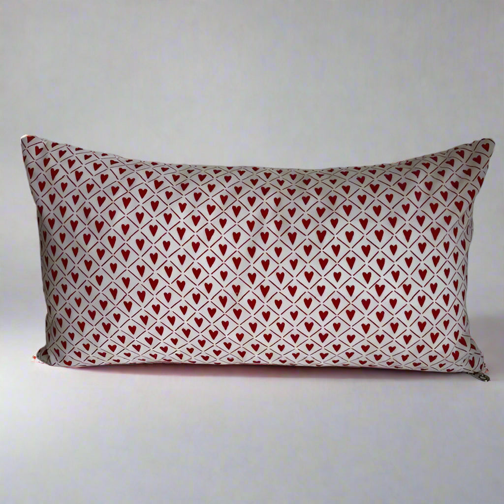 sweet hearts organic cotton Love lumbar pillow. Made with love in Canada, this whimsical pillow adds a touch of fun and comfort! Just the right size to tuck under your neck, it is oh-so-soft and perfect for reading or napping. 