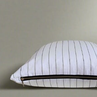 Mixing French countryside charm with modern farmhouse style, our elegant yet casual Pinstripe Linen Pillow Covers feature 100% Oeko-Tex® certified linen and an exposed YKK zipper. The fabric has been specially washed for a soft touch and minimal shrinking, making it a timeless addition to any home or cottage. Made to order. These pillow covers are handmade in Canada. Pillow cover only - insert not included. Size: 18 x 18