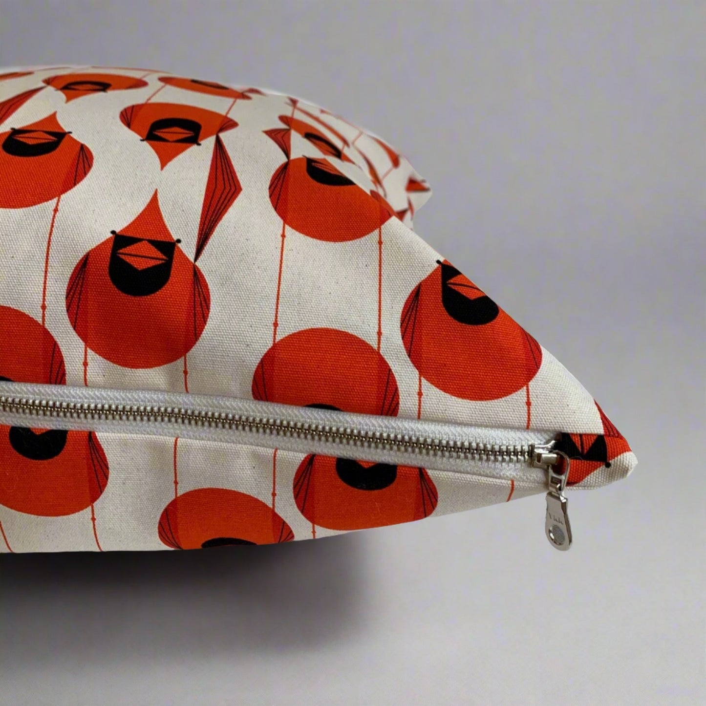 Fabulous and fun, these stylized Cardinal pillow covers are handmade with 100% organic cotton canvas printed with artist Charley Harper’s Cardinal design. The fabric is soft yet sturdy ensuring a long lasting pillow cover. Features an exposed warm white YKK metal zipper. The striking colors will enliven your indoor and outdoor space.  Made to order. These pillow covers are handmade in Canada.  Does not include insert.  Size 20 x 20  Size 12 x 20