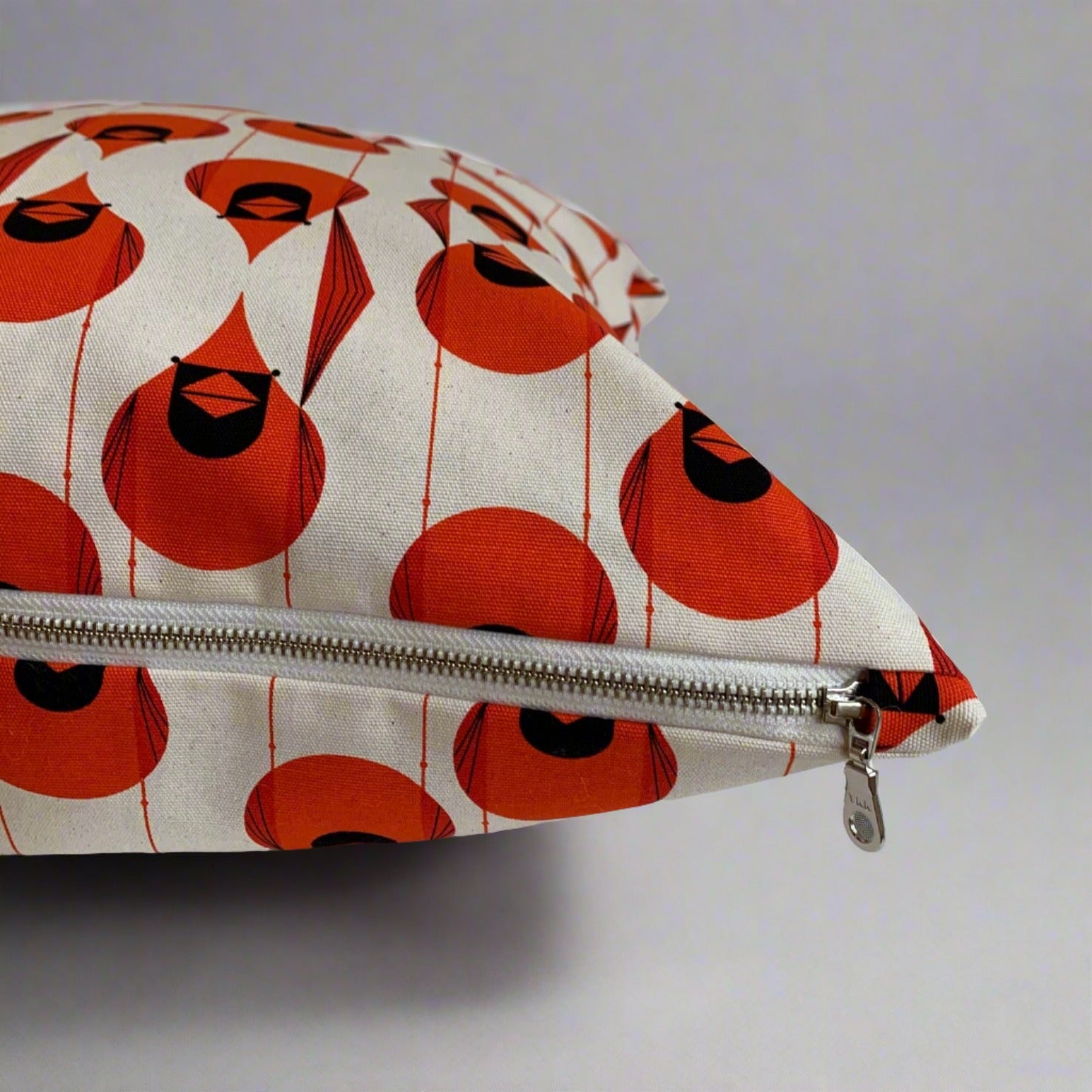 Fabulous and fun, these stylized Cardinal pillow covers are handmade with 100% organic cotton canvas printed with artist Charley Harper’s Cardinal design. The fabric is soft yet sturdy ensuring a long lasting pillow cover. Features an exposed warm white YKK metal zipper. The striking colors will enliven your indoor and outdoor space.  Made to order. These pillow covers are handmade in Canada.  Does not include insert.  Size 20 x 20  Size 12 x 20