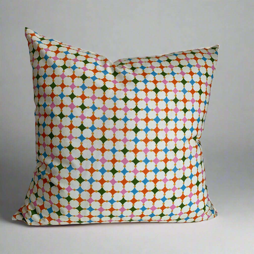 Handcrafted in Canada, this vibrant mosaic of colours will lift your spirits and brighten your space. Made from GOTS certified organic cotton. It's soft to the touch with an exposed orange zipper adding a another pop of colour to this beautiful fabric. Add a touch of whimsy and joy to your home, cottage, bunkie, or sunroom.