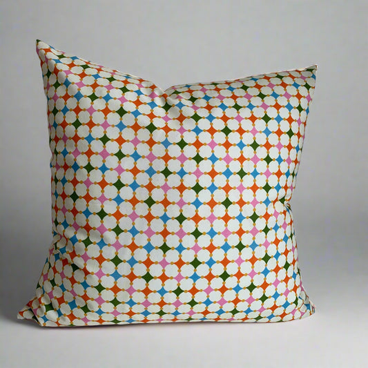 Handcrafted in Canada, this vibrant mosaic of colours will lift your spirits and brighten your space.  Made from GOTS certified organic cotton. It's soft to the touch with an exposed orange zipper adding a another pop of colour to this beautiful fabric. Add a touch of whimsy and joy to your home, cottage, bunkie, or sunroom.