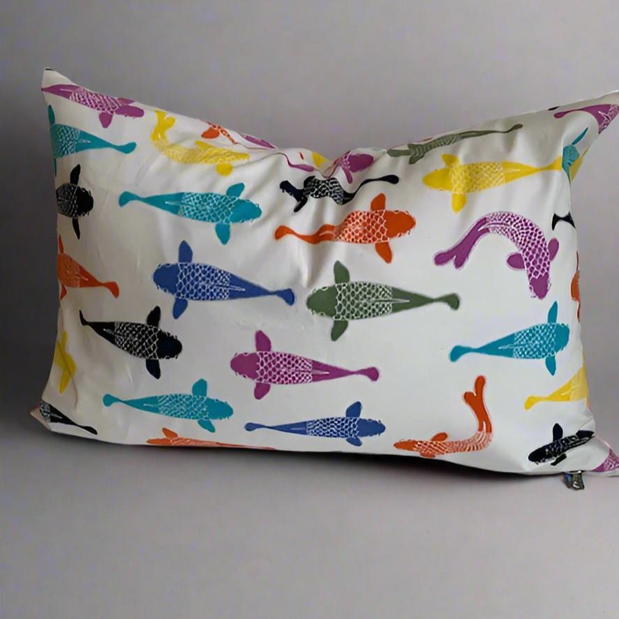 Add a splash of color and humor to any space with our Playing Koi Organic Cotton Pillow. Made from 100% organic cotton and handmade in Canada, this soft pillow cover features a whimsical design of brightly colored Koi fish. Perfect for any age or style.  100% Organic Cotton, handmade in Canada.  Size:  12" x 20" 