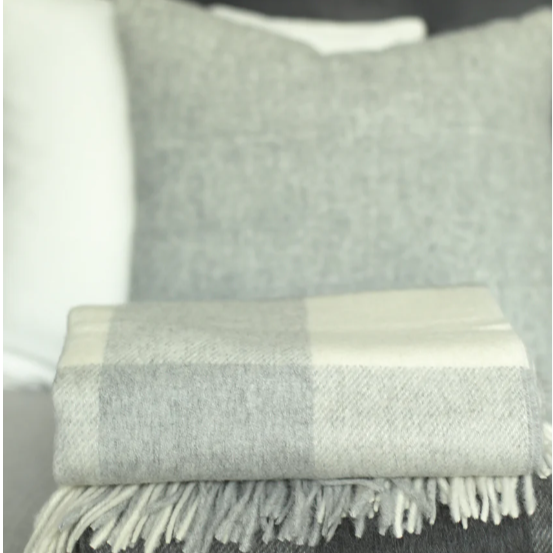 This sustainable and oh so soft basket-weave design throw is a modern twist on a traditional look. Super soft Alpaca wool is sustainable and beautiful!  Alpaca fibres are softer, warmer and more durable than other natural fibres, and are smooth so there is less pilling and look new for a long time. 
Produced in a textile mill that holds the following certificates: Fair Trade Peru, WRAP (Worldwide Responsible Accredited Production), Carbon Footprint Peru, Why Alpaca, RE/UP Cycle, Biotrade Peru, RAS