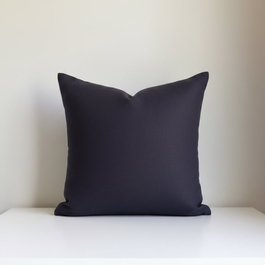 Oeko-Tex certified linen pillow cover in Graphite Blue with a Seal Grey contrasting exposed zipper.