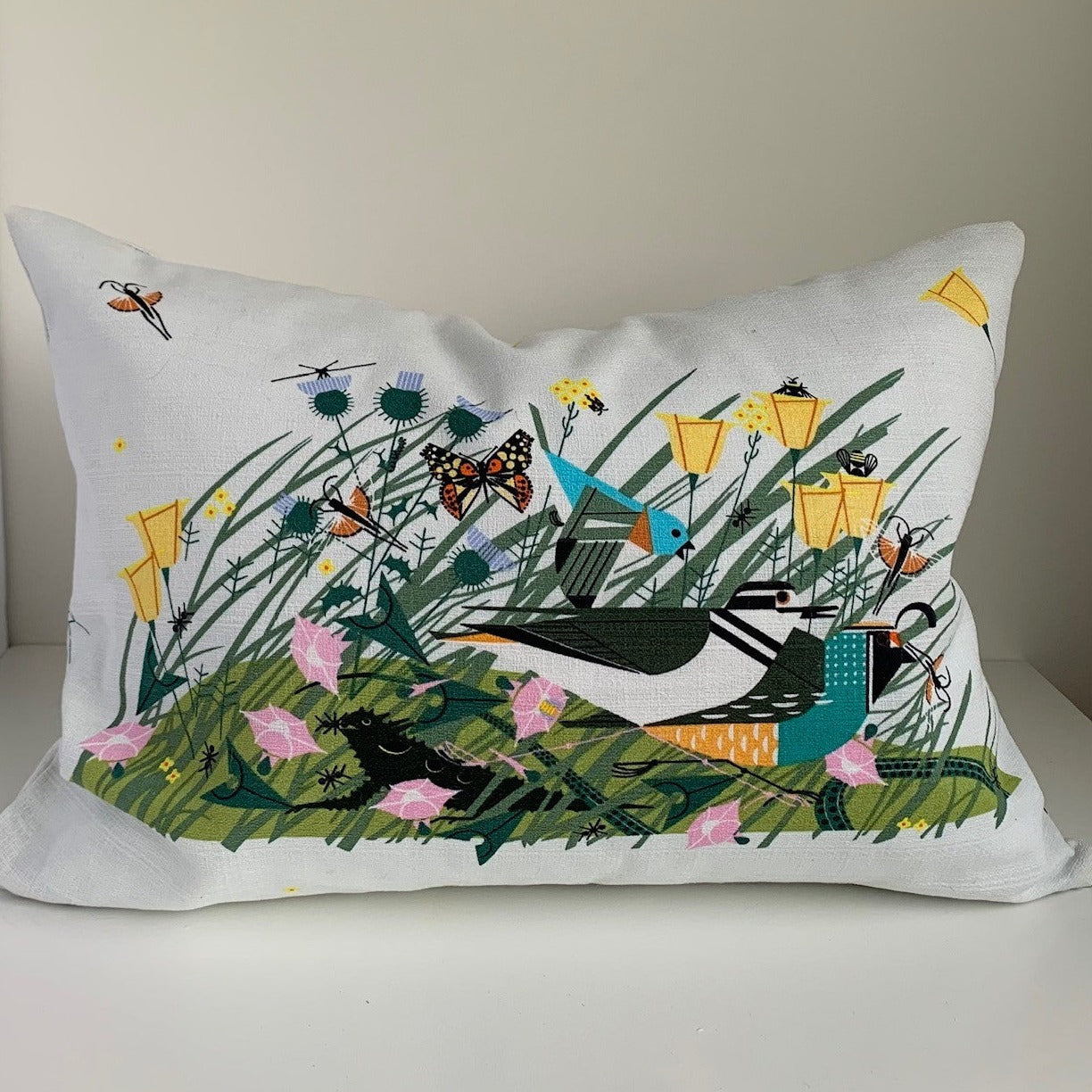 Pillow cover crafted from 100% certified organic cotton printed with Modernist artist Charley Harper’s Once There Was a Field features an exposed contrasting zipper.