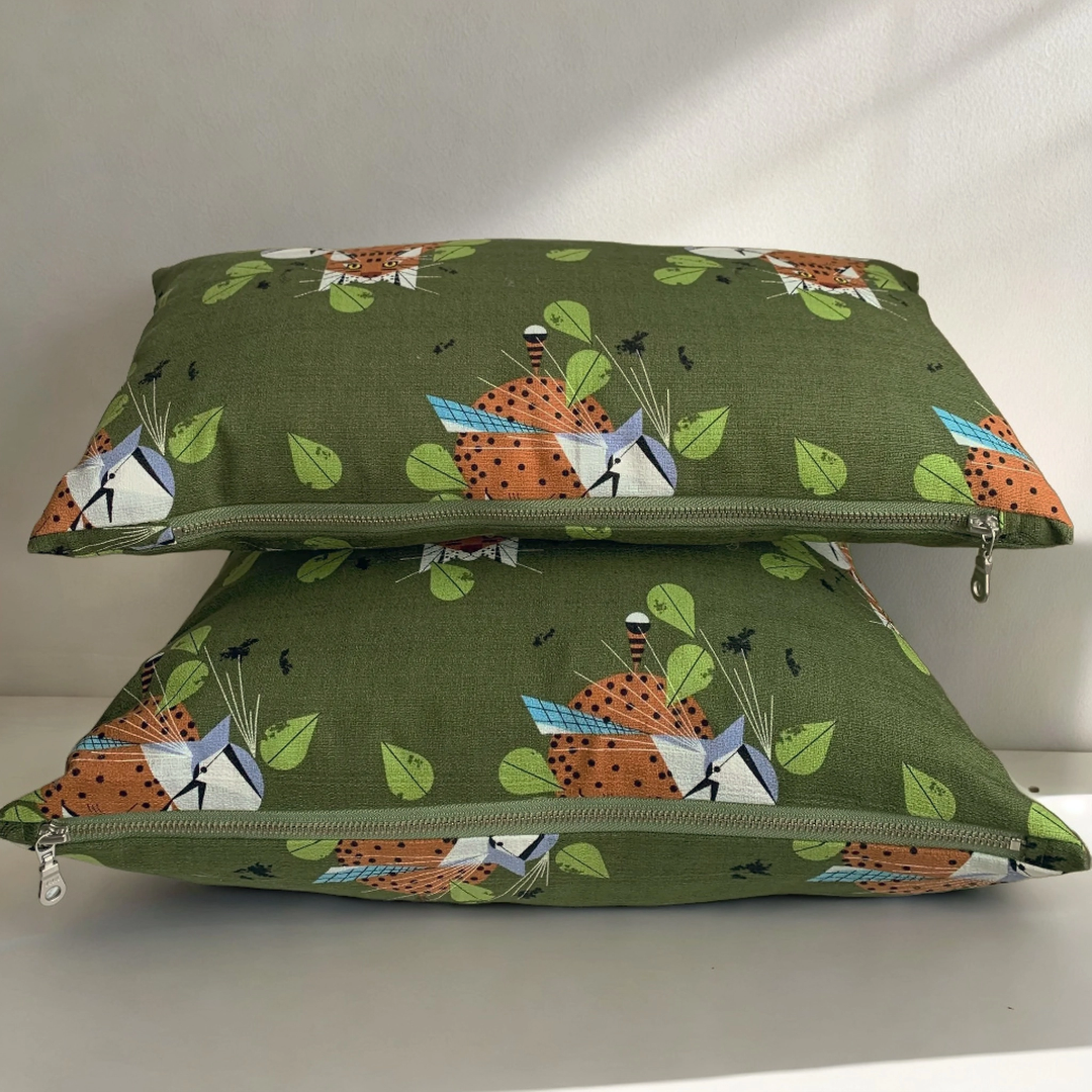 This stunning pillow cover is handmade from 100% organic cotton printed with  artist Charley Harper’s sweet Tabby cat Blue Jay Patrol design. The pillow features an exposed YKK zipper. The striking colors will enliven your indoor and outdoor space.  Made to order. These pillow covers are handmade in Canada, slight variations may occur.  10' x 18' Lumbar Pillow includes down alternative insert.  Insert made in Canada with 100% cotton cover.  Size: 18 x 18 inches does not include insert.