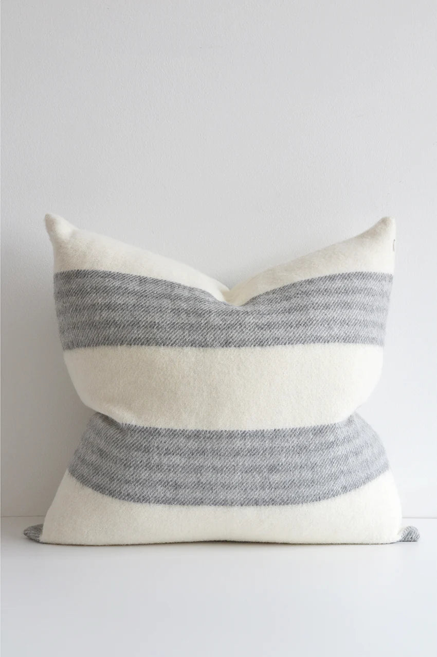 Made in Canada, this stunning pillow is soft to the touch with a contemporary horizontal stripe. This pillow looks great in any decor. Made of 55% Alpaca 45% Wool Size: 22x22" Designed and made in Canada Pillow cover only