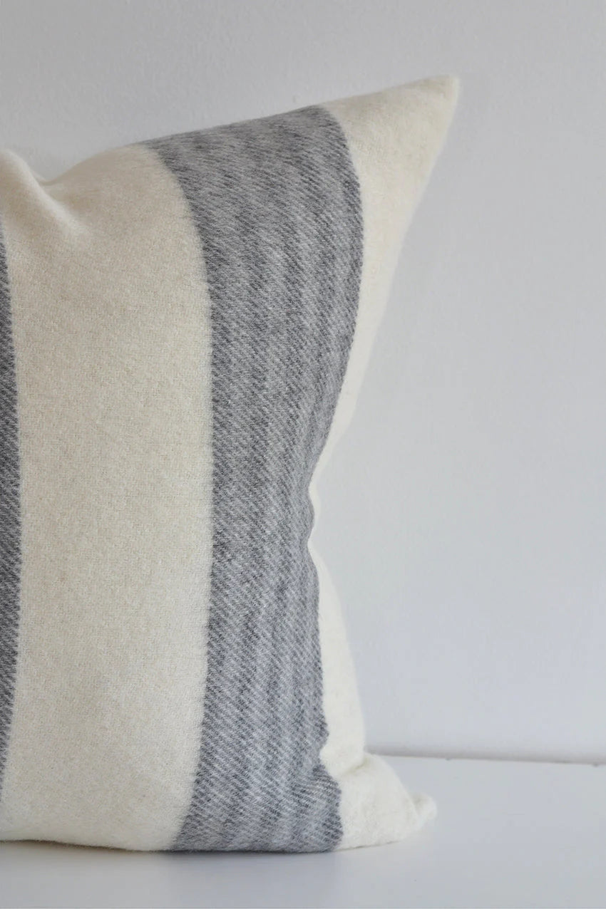 Made in Canada, this stunning pillow is soft to the touch with a contemporary horizontal stripe. This pillow looks great in any decor. Made of 55% Alpaca 45% Wool Size: 22x22" Designed and made in Canada Pillow cover only