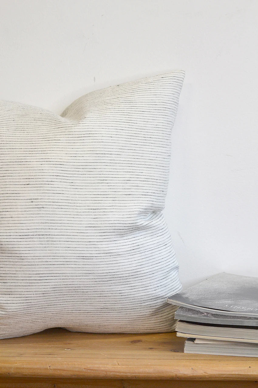 This linen pillow cover features dapper dashes and dots for a fashionable and one-of-a-kind look that works with any decor. Crafted from sumptuous & sustainable 100% linen and made in Canada, it's easy to care for, machine washable with zipper closure - so lux! Size 22 x 22 Made in Canada Machine washable  Inserts not included