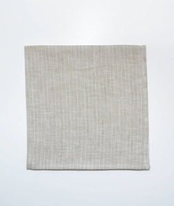 Beautifully crafted in Oeko-Tex linen, these soft beige napkins have subtle thin stripes that will grace any table. Perfect for fancy or fuss free tables, these napkins are sustainable, absorbent, lint free and gorgeous!   100% linen Size is 18x18" Designed in Canada and made in Europe  Machine washable