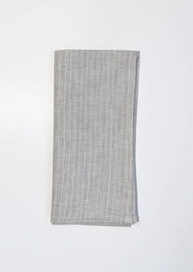 Beautifully crafted in Oeko-Tex linen, these soft grey napkins have a subtle thin, white stripe that will grace any table. Perfect for fancy or fuss free tables, these napkins are sustainable, absorbent, lint free and gorgeous!   100% linen Size is 18x18" Designed in Canada and made in Europe  Machine washable