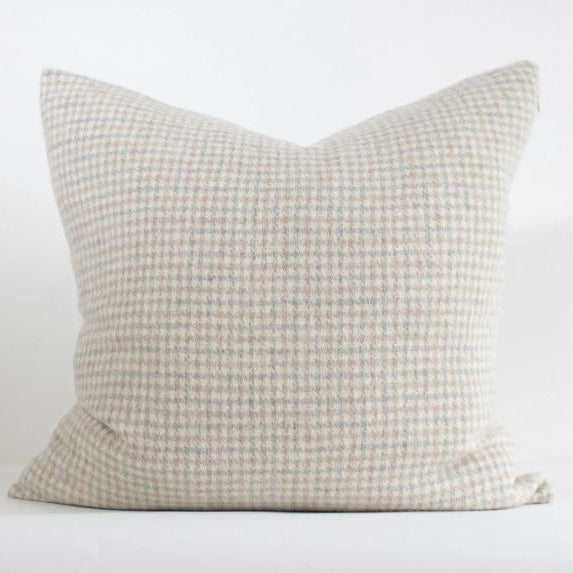 Made in Canada, this beautiful wool pillow cover is thick and soft with shades of Light Grey, Ivory &amp; Tan, and layers seamlessly with various colors and textures. Made from Responsible Alpaca Standard (RAS) wool, it is not only incredibly soft but ethically produced and built to withstand the test of time. Sustainable living, beautifully crafted.&nbsp;

Measurements: 22"W x 22"L
Materials: RAS 55% Alpaca 45% Wool
Designed and Hand-made in Canada