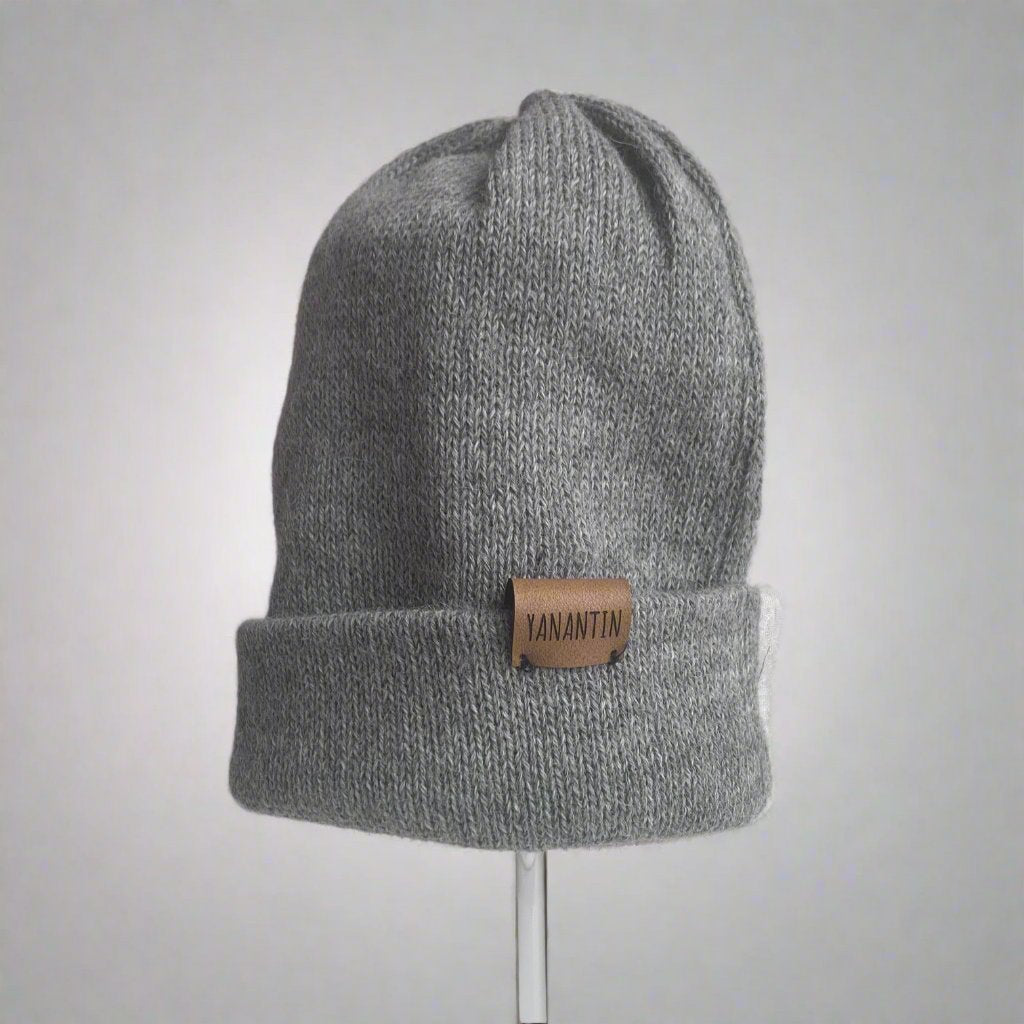 Silver Grey colour, soft and ethically produced hats are crafted with 100% Superfine Alpaca wool. They are warm, water repellant and wind resistant. And Alpaca wool is breathable so no sweaty heads! With a reversible label you can wear your Beanie rolled up or slouchy.

Yanantin hats are handmade in Bolivia by a network of independent knitters who earn a good income in a safe and happy environment. You will look great and feel good knowing your Beanie is empowering women in Bolivia 