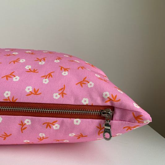 Handcrafted in Canada, the Pink Petal Party pillow is super sweet! Made from GOTS certified organic cotton. It's soft to the touch with an exposed orange zipper adding a another pop of colour to this beautiful fabric. Add a touch of whimsy and joy to your home, cottage, bunkie, or sunroom.