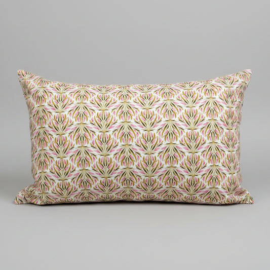 Capture spring's fresh palette with this handcrafted organic cotton lumbar pillow with soft pink flowers and lush green grasses. Made in Canada with GOTS certified cotton, these pillow covers are soft to the touch and feature an exposed zipper detail.

About our Pillows
Lumbar size: 14" x20" &nbsp;
GOTS certified Organic Cotton
YKK Zippers produced in Canada
Machine washable, gentle cycle, warm