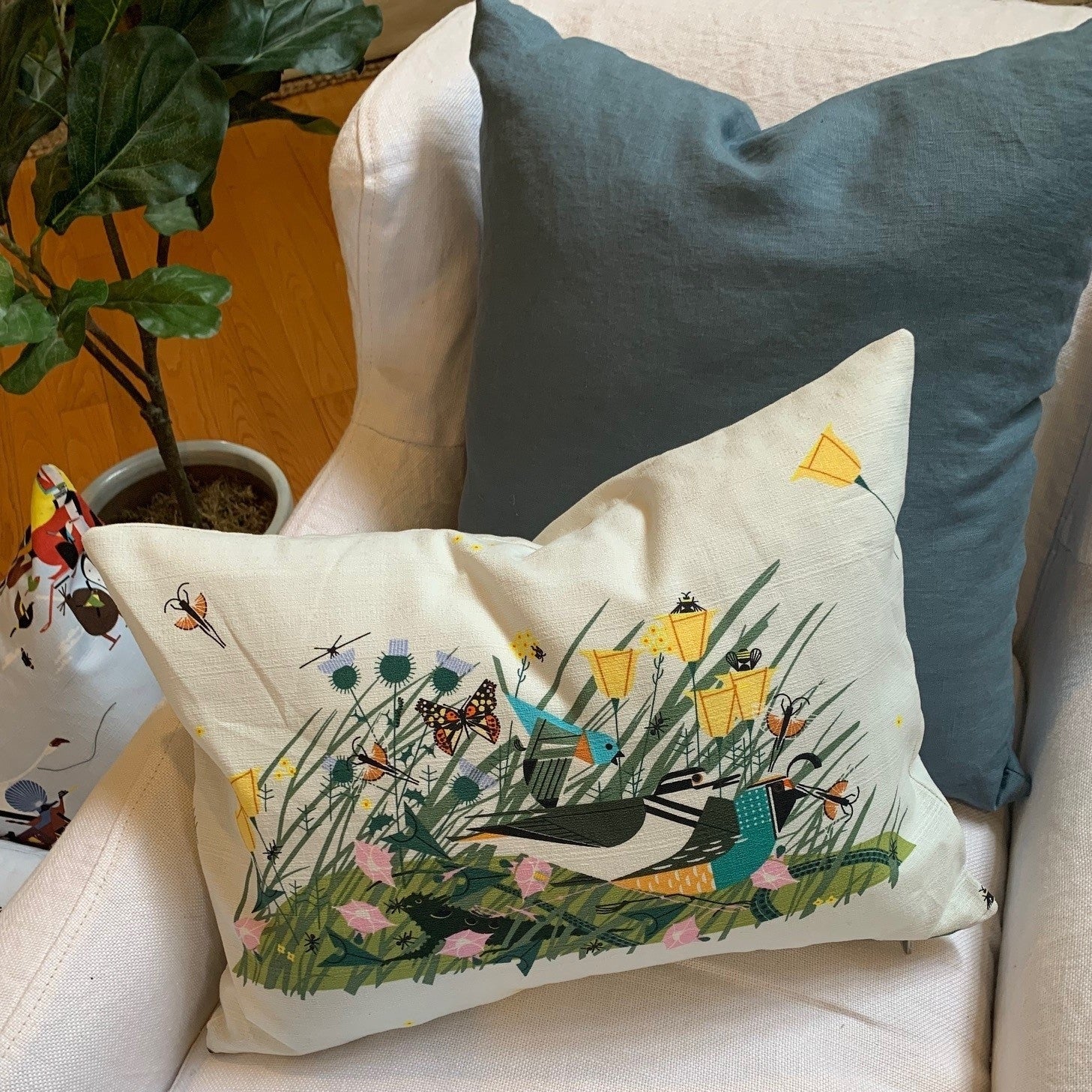 pillow cover crafted from 100% certified organic cotton printed with Modernist artist Charley Harper’s Once There Was a Field features an exposed contrasting zipper. 