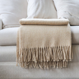 •	Classic design and feel in this beautiful throw with long fringe  100% Merino Wool  size55"x78"