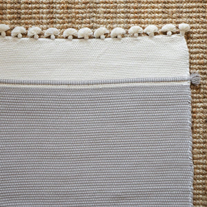 Ethically handwoven and luxurious, this 100% cotton mat 
