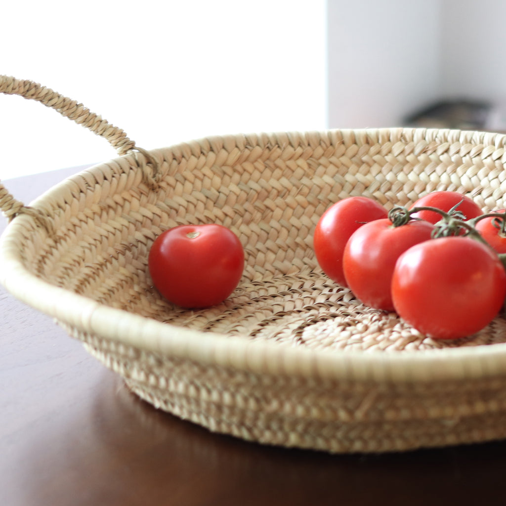 Versatile Handwoven Straw Platter with vine ripened tomatoes